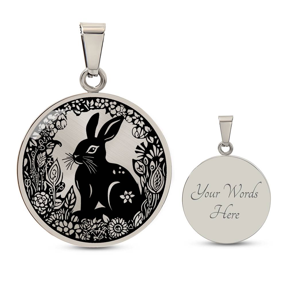 Elegant silver pendant Easter Bunny necklace featuring Silver bunny with leaves and flowers all in silver with a black background. This jewelry offers personalization with an engraving option for a name.