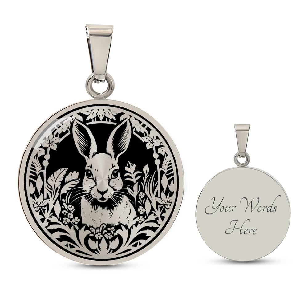 Elegant silver pendant featuring a Rabbit silhouette, The rabbit is hiding in the grass, set against a black backdrop. This necklace offers personalization with an engraving option for a name.