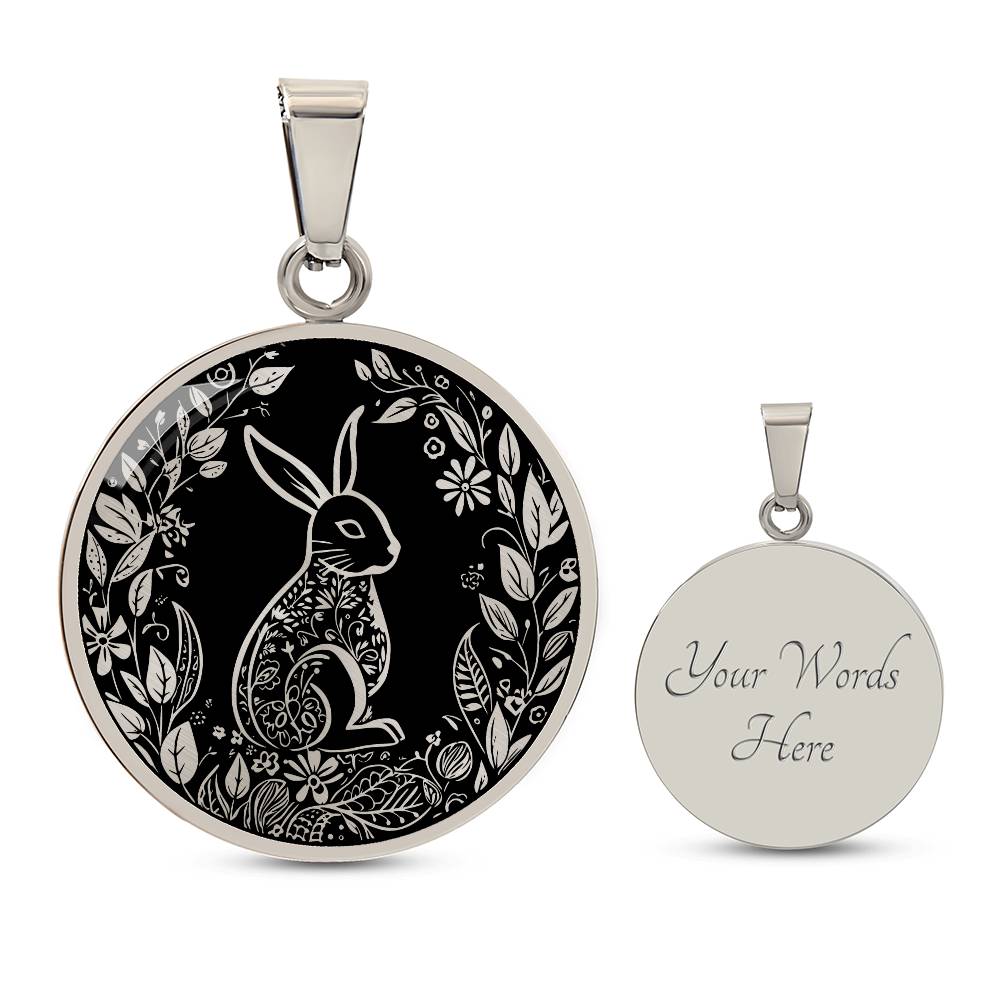 Elegant silver pendant Easter Bunny necklace featuring Silver bunny with leaves and flowers all in silver with a black background. This jewelry offers personalization with an engraving option for a name.