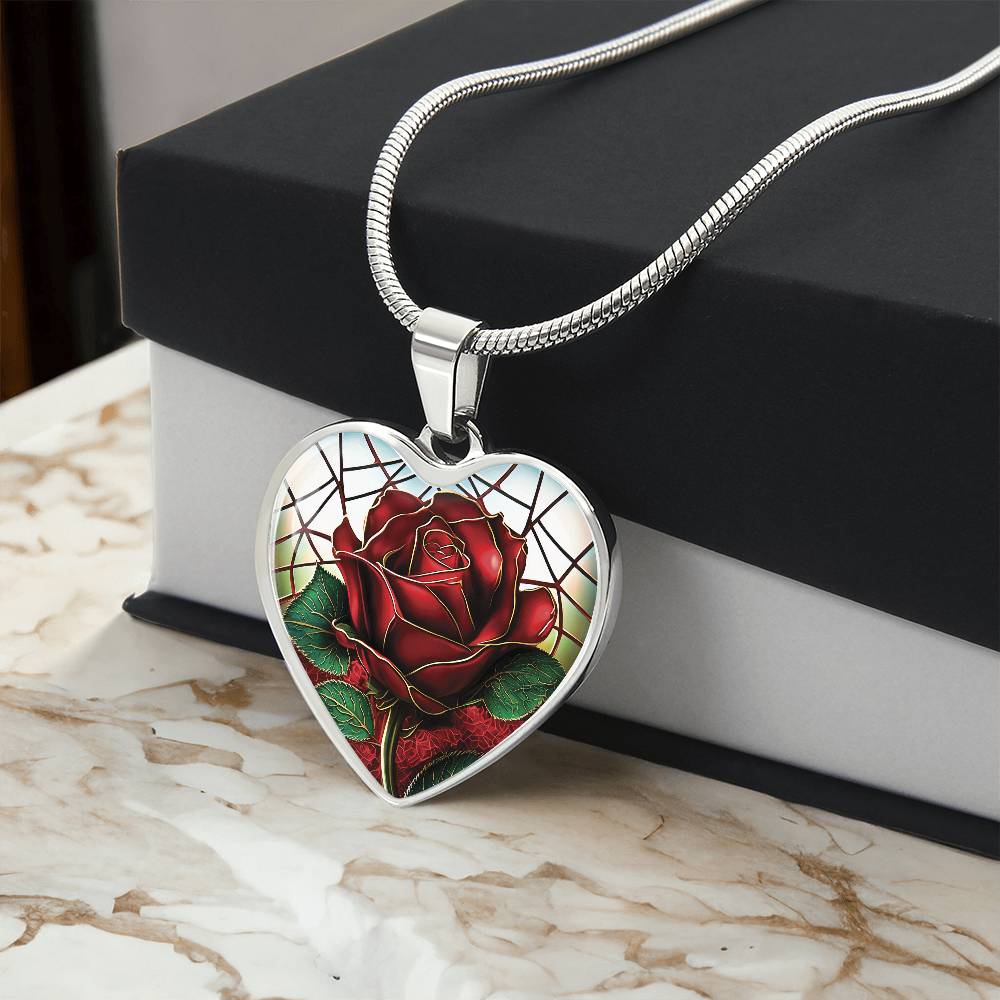 Gift box with an Elegant Silver pendant featuring a vivid red Rose, June's birth month flower, set against a subtle stained glass backdrop. This necklace offers personalization with an engraving option for a name.