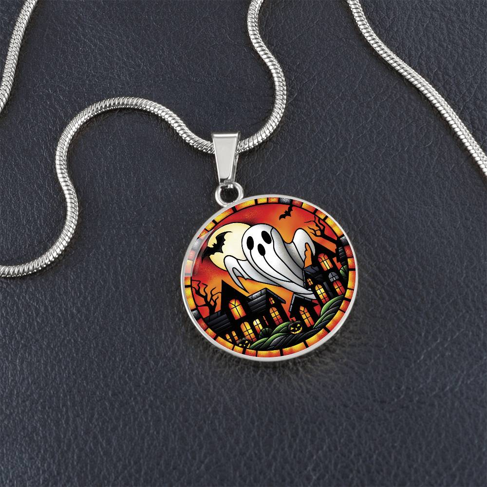 An elegant silver pendant Halloween Ghost Necklace. The colors are white, black, yellow, orange and green. This jewelry offers personalization with an engraving option for a name.