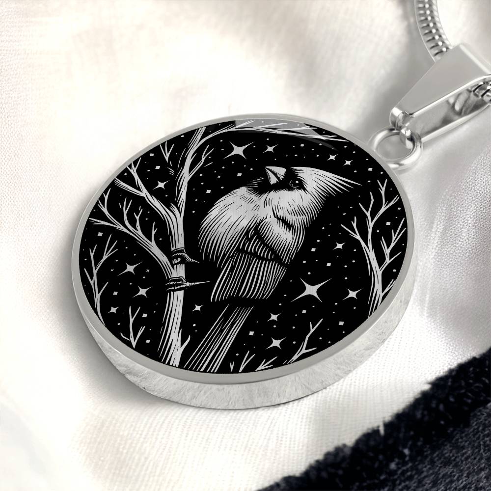 An Elegant silver pendant featuring a vivid Silver Northern Cardinal Necklace with Stars and a tree Branch all in a silver and black backdrop. This jewelry offers personalization with an engraving option for a name.