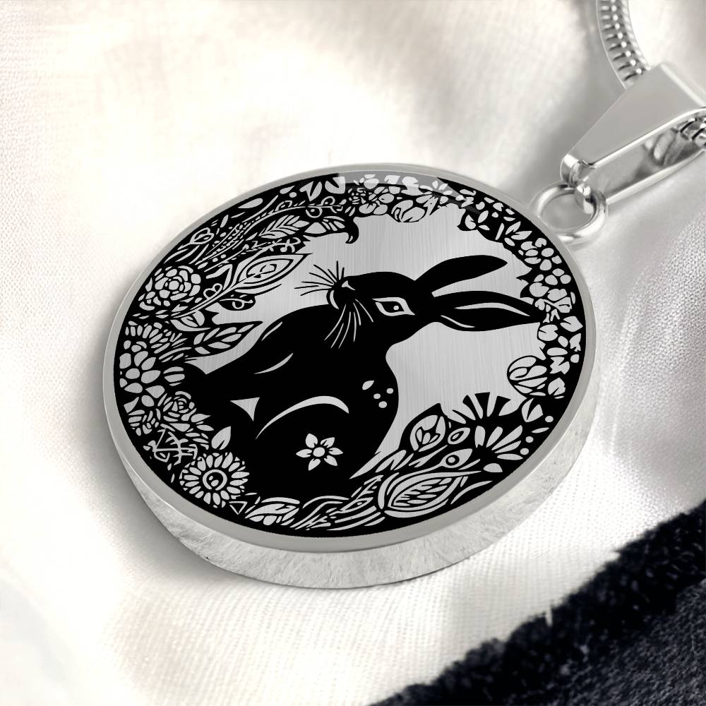 Elegant silver pendant Easter Bunny necklace featuring Silver bunny with leaves and flowers all in silver with a black background. This jewelry offers personalization with an engraving option for a name.