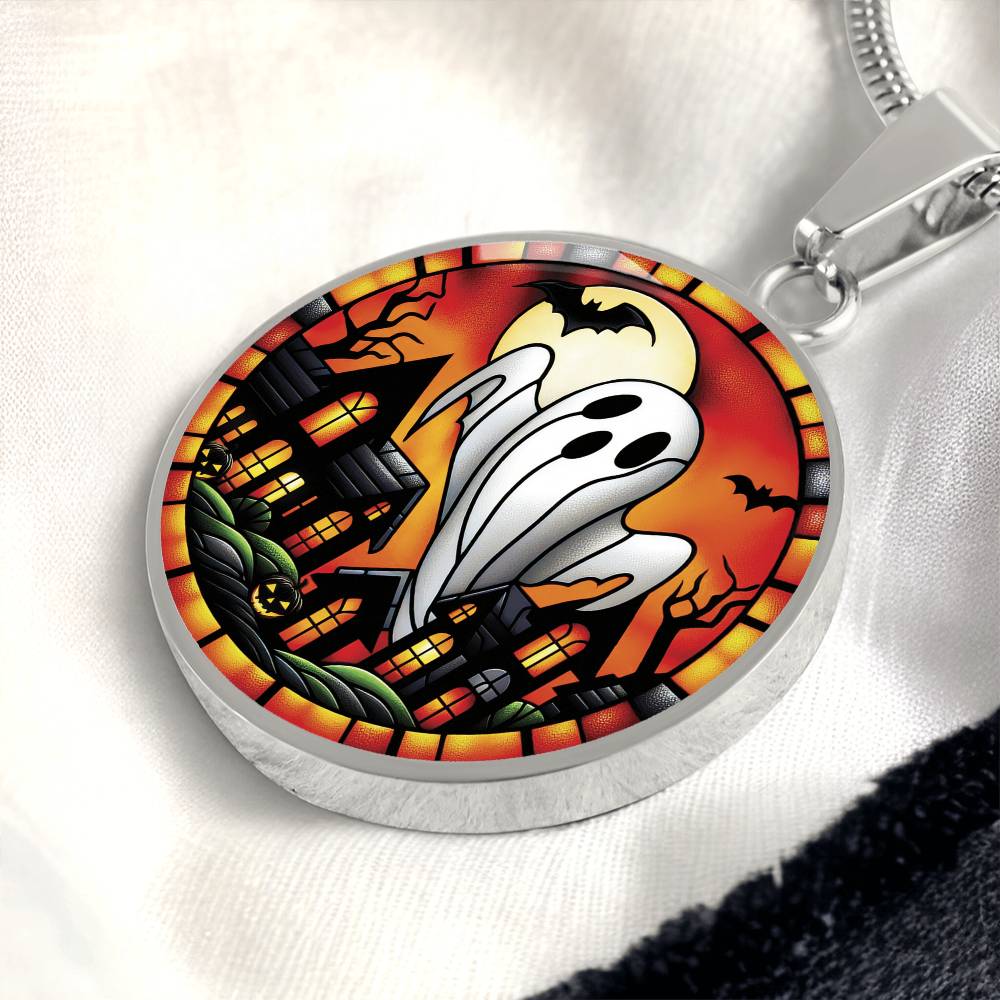 An elegant silver pendant Halloween Ghost Necklace. The colors are white, black, yellow, orange and green. This jewelry offers personalization with an engraving option for a name.