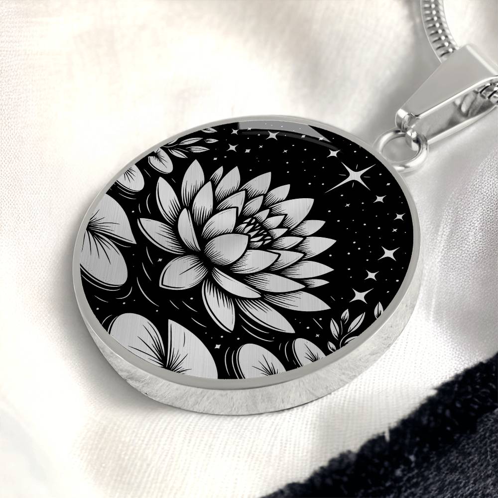 An Elegant silver pendant Water Lily Necklace featuring Stars, Lily Pads and a Water lily, all in black and silver. This jewelry offers personalization with an engraving option for a name.