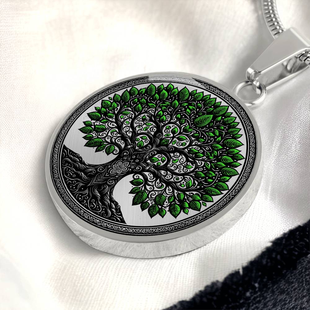 an Elegant silver pendant Celtic Tree of Life Necklace. Colors are black, silver and Green Leaves. This jewelry offers personalization with an engraving option for a name.