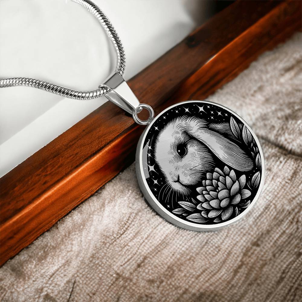 Elegant silver pendant Water Lily Bunny necklace. Colors are silver with a black background. This jewelry offers personalization with an engraving option for a name.