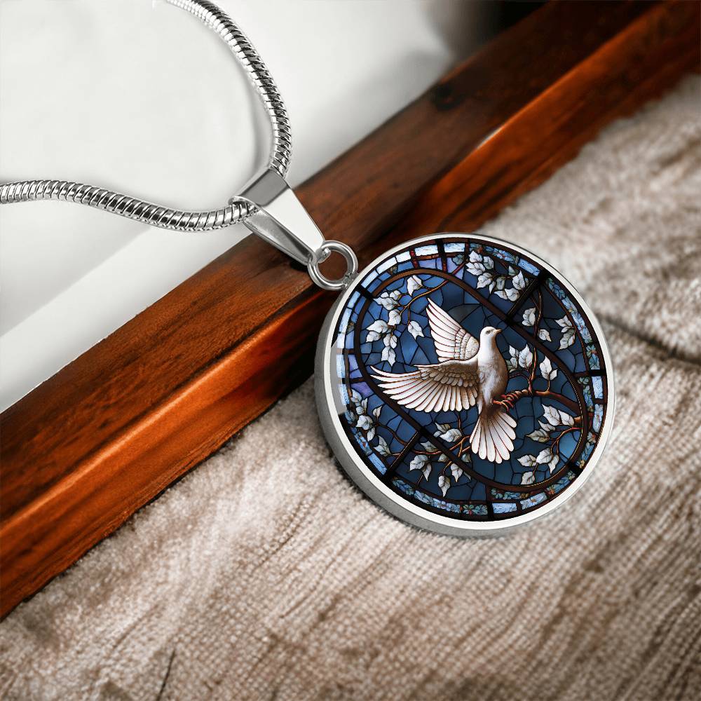 An elegant silver pendant White Dove Necklace. The Colors are white, brown and blue This jewelry offers personalization with an engraving option for a name.