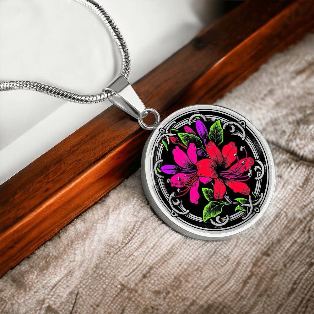 Elegant silver pendant featuring a vivid red, Pink & Purple honeysuckles, Junes birth month flower, set against a black backdrop with the metal shinning through. This necklace offers personalization with an engraving option for a name.