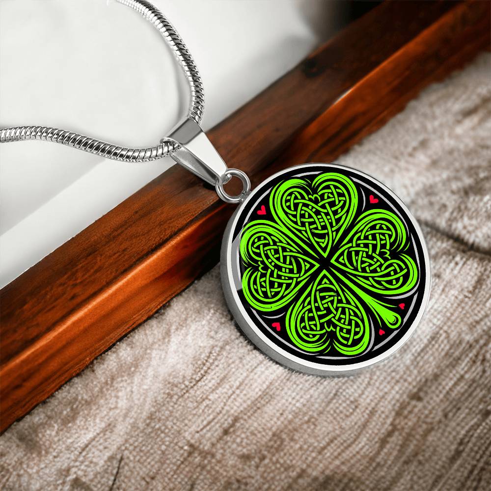Elegant Silver pendant necklace featuring a vivid Celtic four leaf clover with four red & Green hearts, set against a subtle Black & silver backdrop. This jewelry offers personalization with an engraving option for a name.