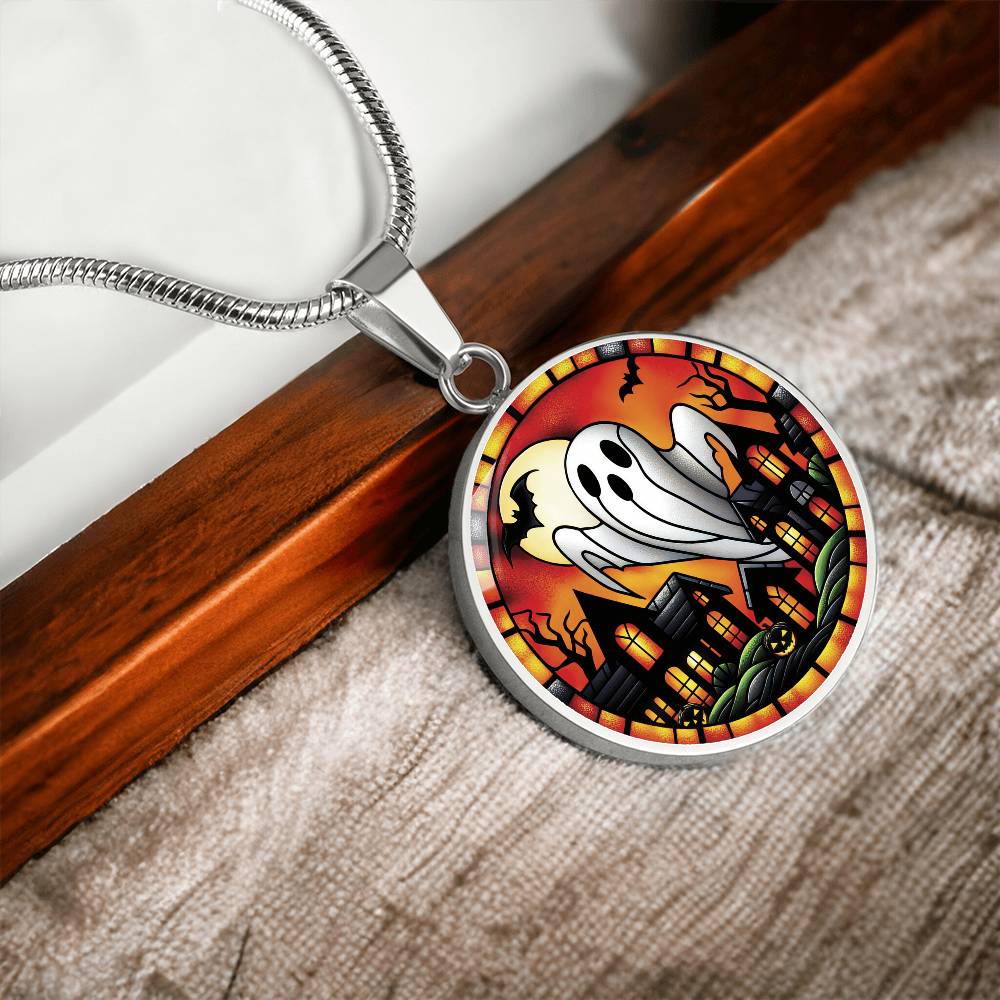 An elegant silver pendant Halloween Ghost Necklace. The colors are white, black, yellow, orange and green. This jewelry offers personalization with an engraving option for a name.