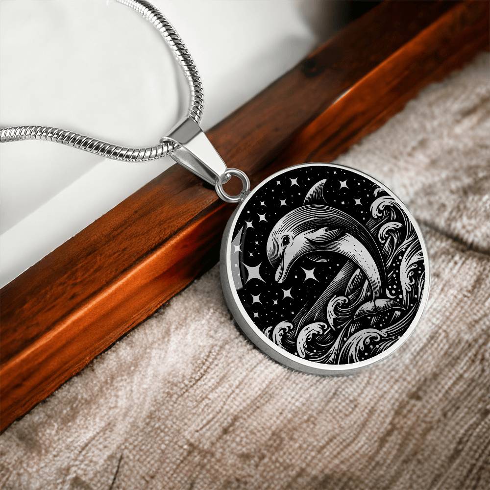 Elegant silver pendant featuring a vivid Silver Dolphin Necklace with a Stars and Ocean Waves set against a silver and black backdrop. This jewelry offers personalization with an engraving option for a name.