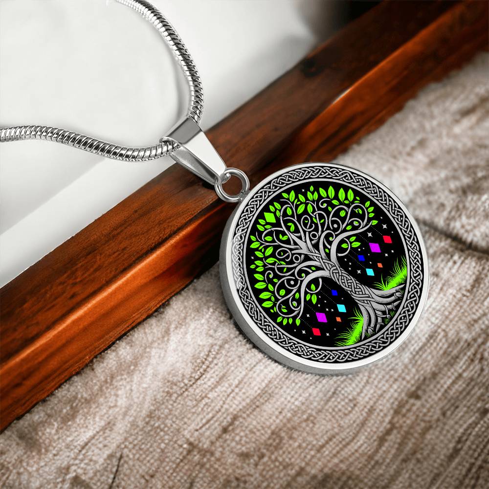 an Elegant silver pendant Tree of Life necklace featuring a vivid Celtic Green and silver tree, set against a black backdrop with red,blue,purple,orange gems. This jewelry offers personalization with an engraving option for a name.