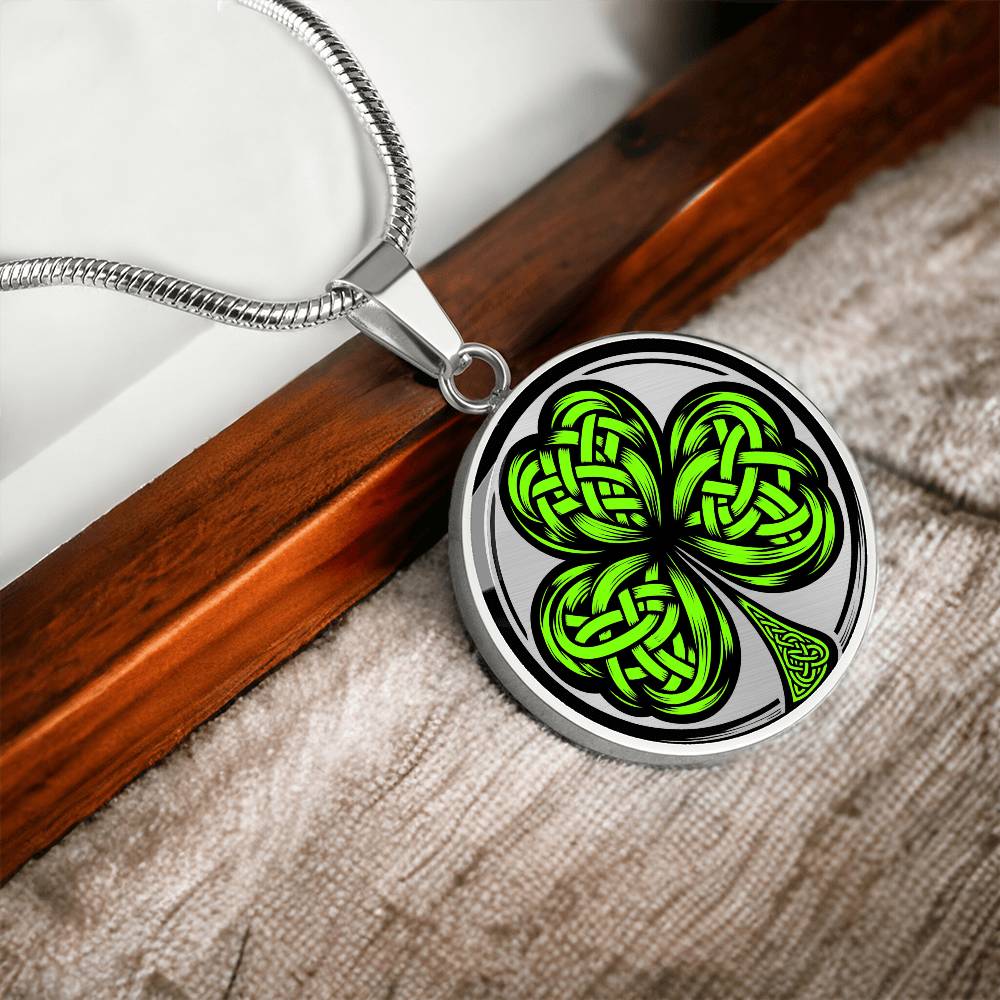 Elegant silver pendant necklace featuring a vivid Green Celtic Clover set against a silver & black backdrop. This necklace offers personalization with an engraving option for a name.