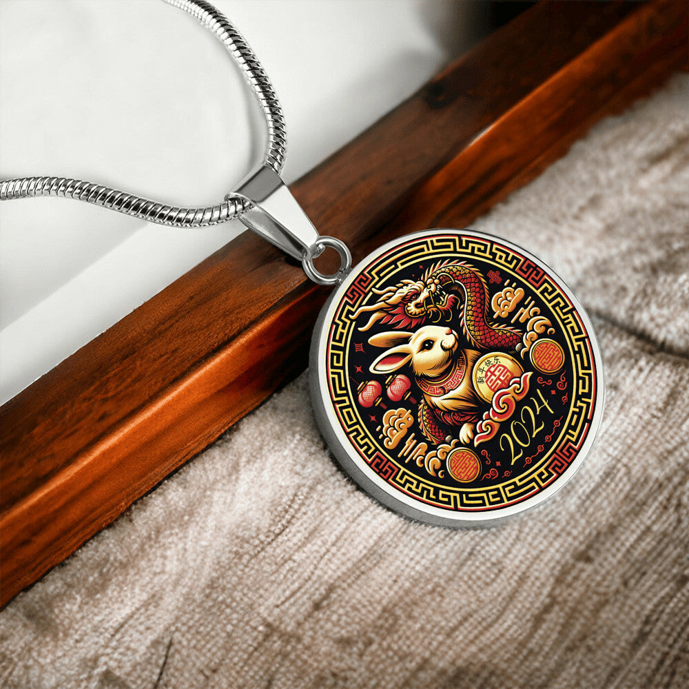 An Elegant silver pendant Year of the Rabbit and Year of the Dragon Necklace. The colors are yellow, Red and Black . This jewelry offers personalization with an engraving option for a name.