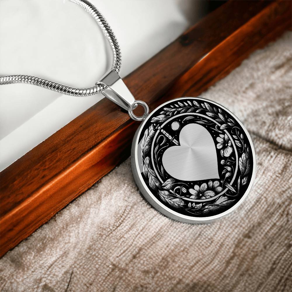 An Elegant silver pendant featuring a Valentines Design with a vivid Silver Moonlight Heart Necklace, set against a silver and black backdrop with a sword and flowers. This jewelry offers personalization with an engraving option for a name.