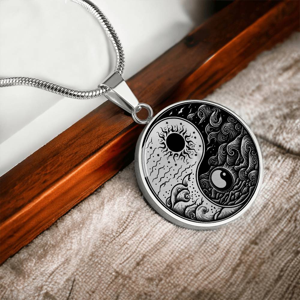 An Elegant silver pendant featuring a vivid Silver and Black Sun and Moon Necklace. This jewelry offers personalization with an engraving option for a name.