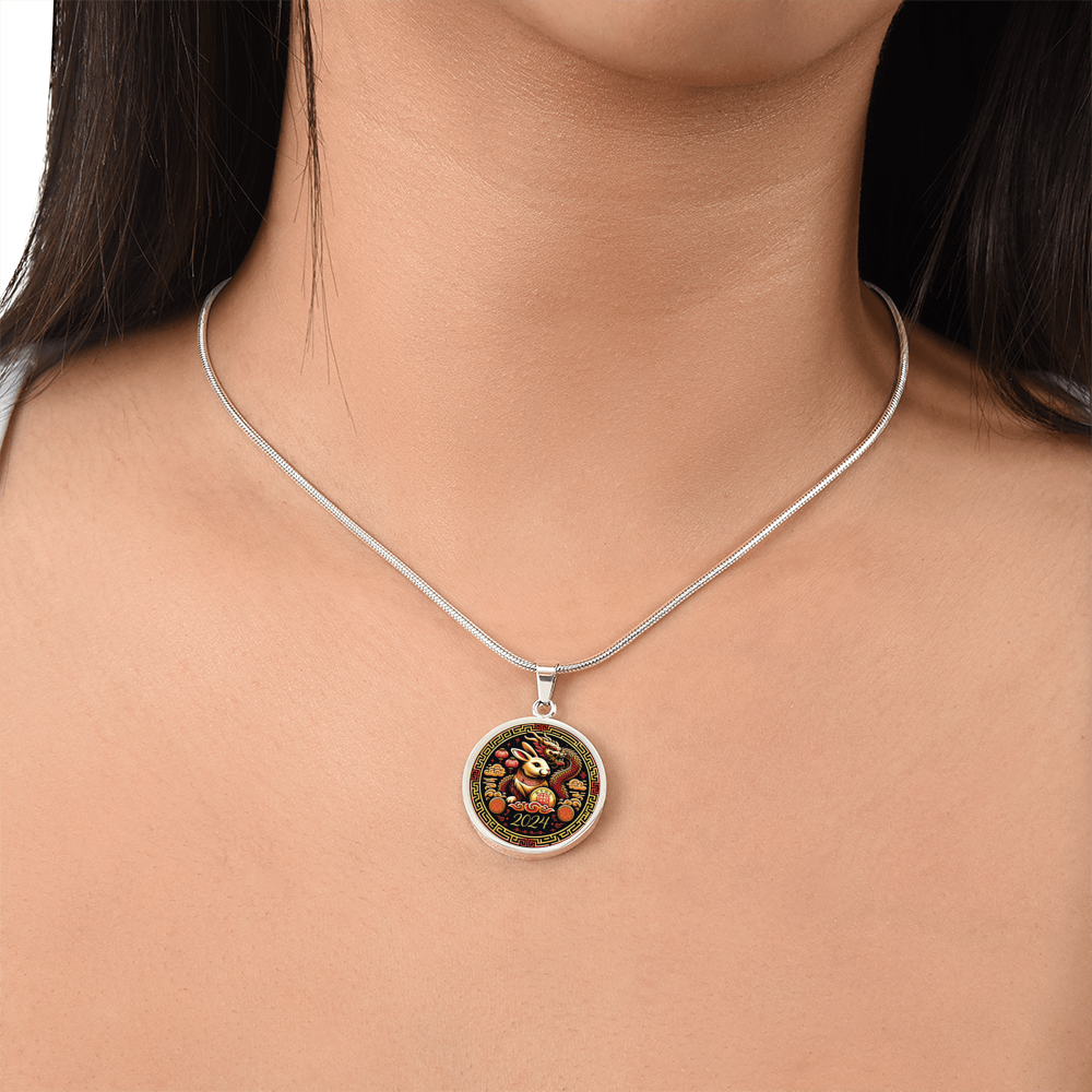 Woman wearing an Elegant silver pendant Year of the Rabbit and Year of the Dragon Necklace. The colors are yellow, Red and Black . This jewelry offers personalization with an engraving option for a name.