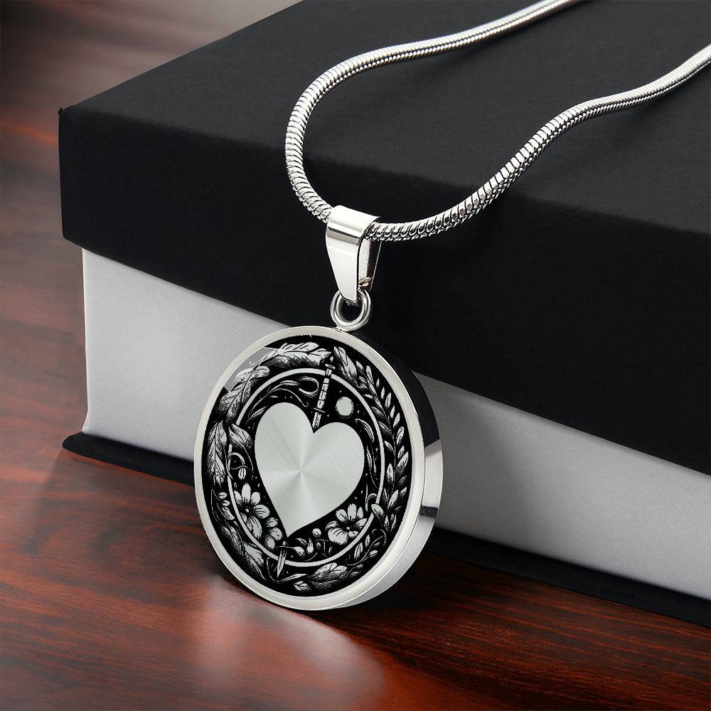 Gift box with An Elegant silver pendant featuring a Valentines Design with a vivid Silver Moonlight Heart Necklace, set against a silver and black backdrop with a sword and flowers. This jewelry offers personalization with an engraving option for a name.