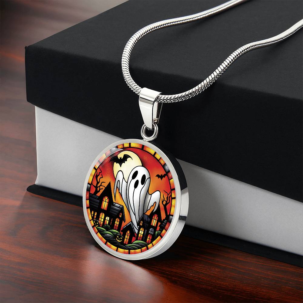 Gift box with an elegant silver pendant Halloween Ghost Necklace. The colors are white, black, yellow, orange and green. This jewelry offers personalization with an engraving option for a name.