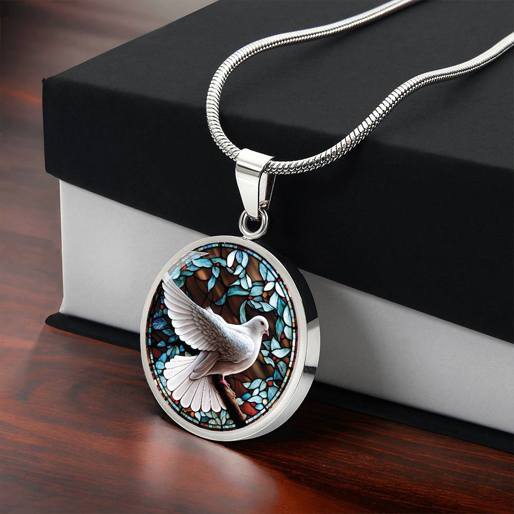 Gift box with an Elegant silver pendant Dove Bird Necklace. featuring a white dove, green, blue, red colored border, leaves, berries with a brown background. This jewelry offers personalization with an engraving option for a name.