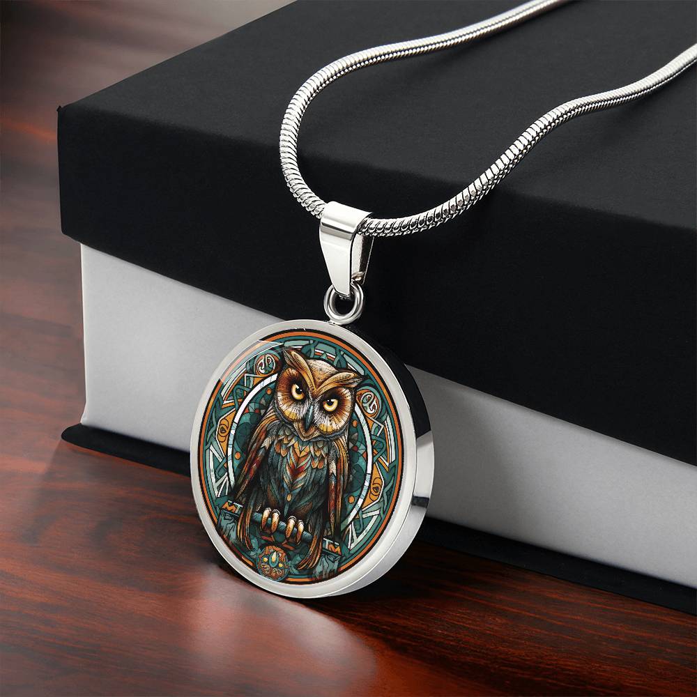 Gift box with an elegant silver pendant featuring a Celtic Owl Necklace, set against a Green and orange backdrop. This jewelry offers personalization with an engraving option for a name.