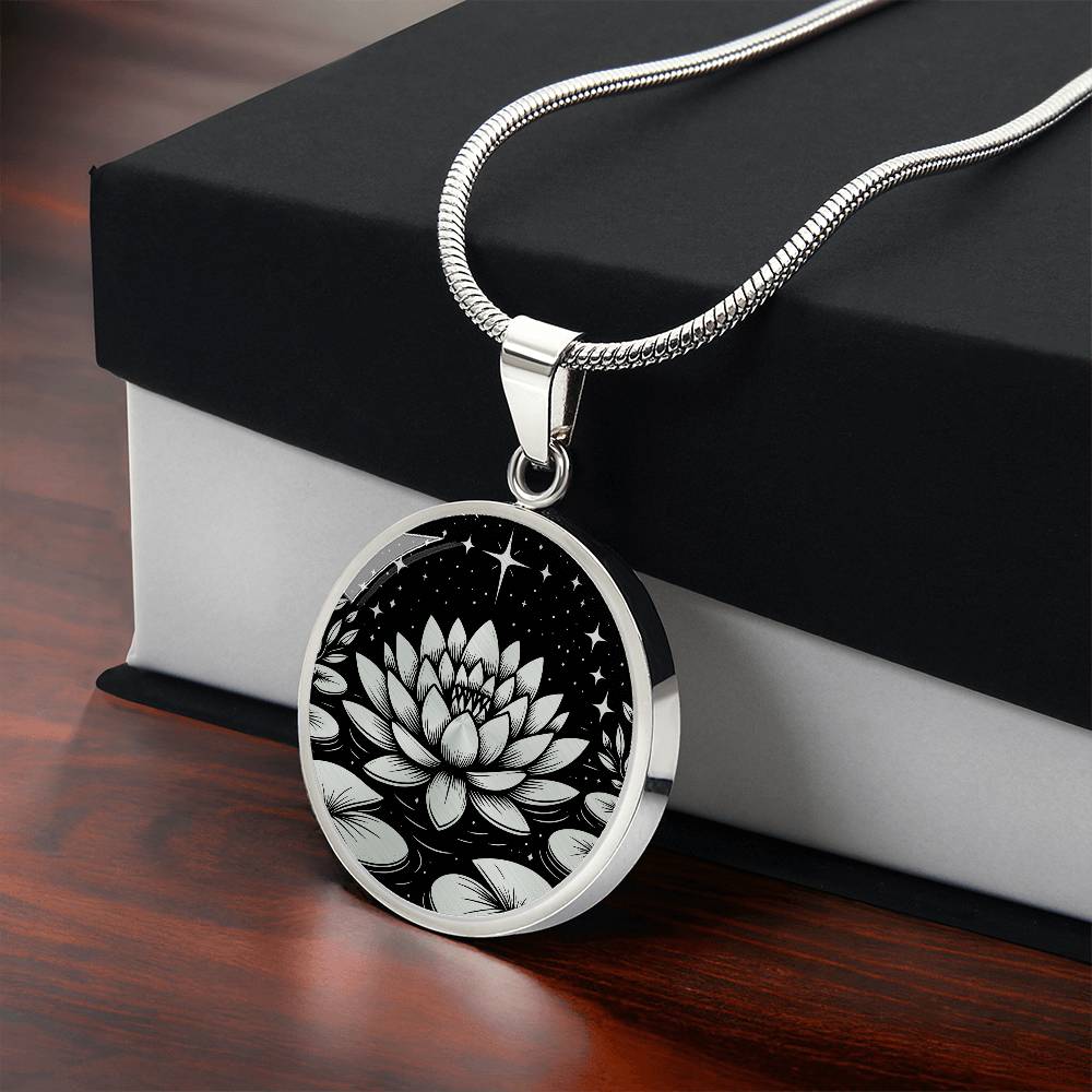 Gift Box With An Elegant silver pendant Water Lily Necklace featuring Stars, Lily Pads and a Water lily, all in black and silver. This jewelry offers personalization with an engraving option for a name.