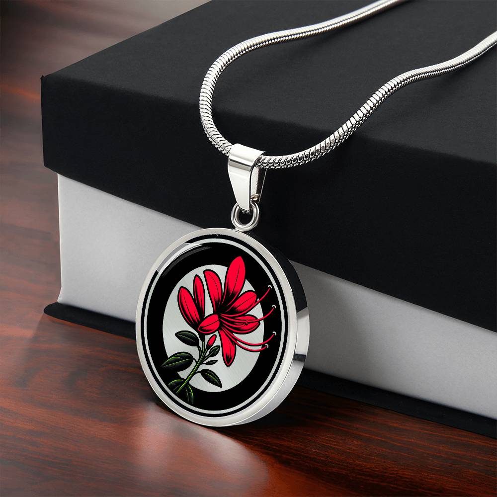 Gift Box with an Elegant silver pendant featuring a vivid red honeysuckle, Junes birth month flower, set against a subtle tan backdrop. This necklace offers personalization with an engraving option for a name.