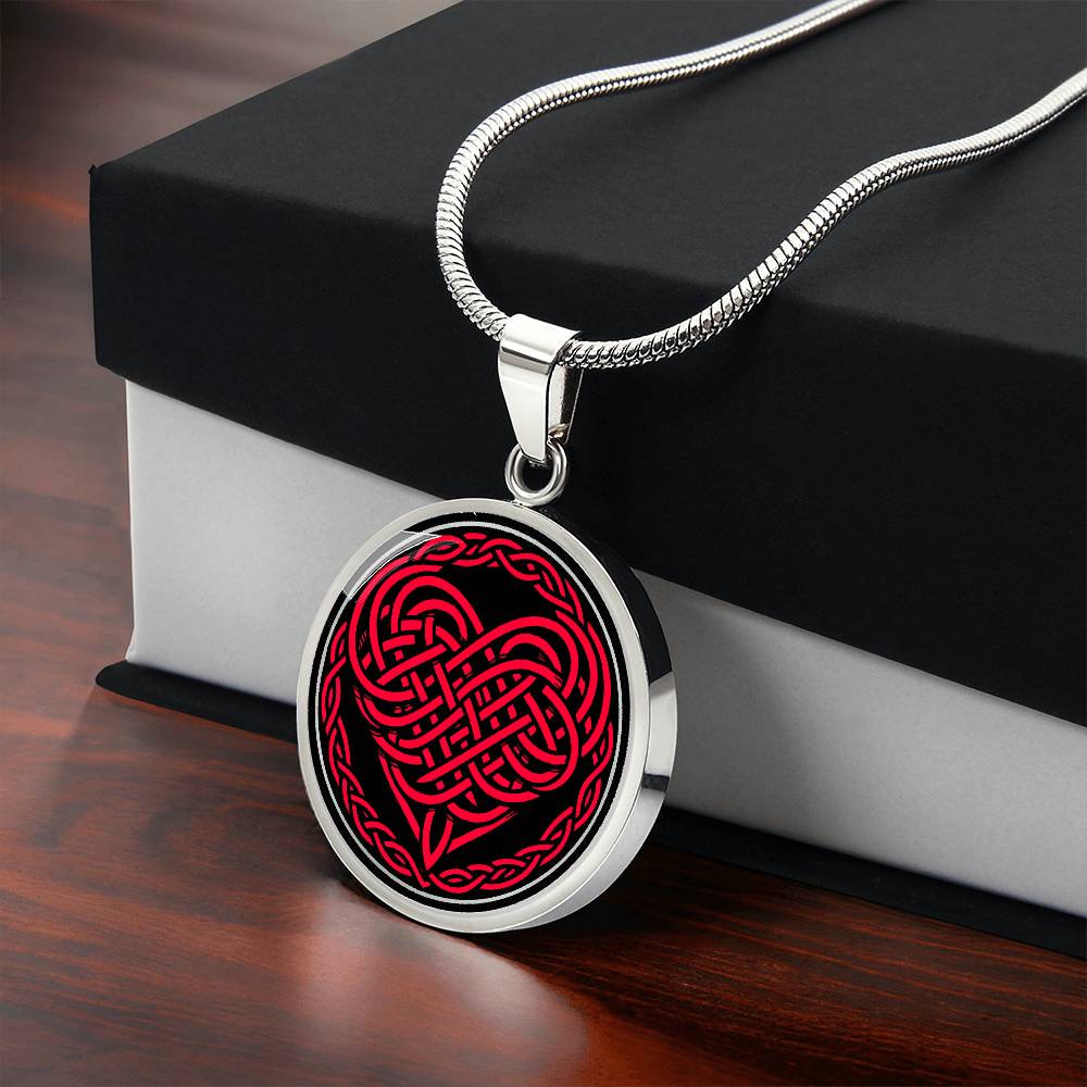 Gift Box with an Elegant silver pendant featuring a vivid red Heart Celtic Necklace set against a Black & silver backdrop. This jewelry offers personalization with an engraving option for a name.