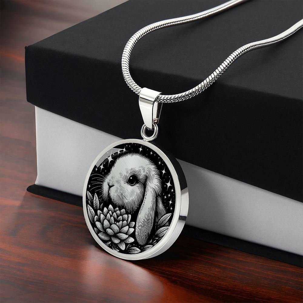 Gift box with an Elegant silver pendant Water Lily Bunny necklace. Colors are silver with a black background. This jewelry offers personalization with an engraving option for a name.