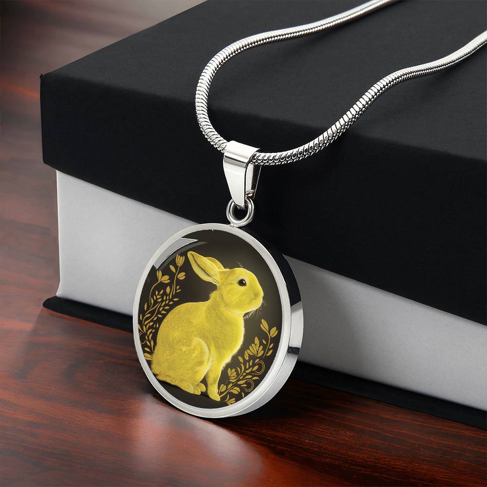 Gift box with an Elegant silver pendant Rabbit Necklace. Yellow Rabbit and Flowers with a black and brown backdrop. This jewelry offers personalization with an engraving option for a name.