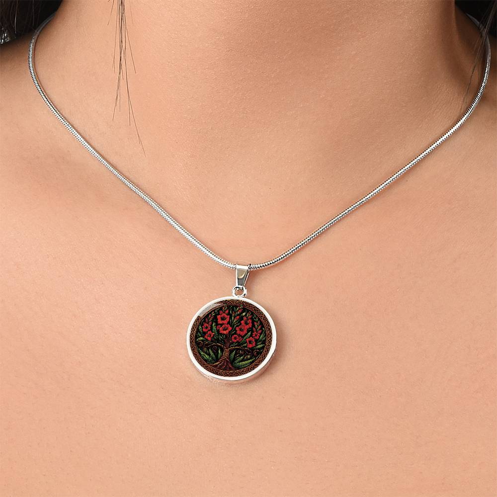 Woman wearing an elegant silver pendant Gladiolus Tree of Life Necklace. The Colors are red, green, brown and black. This jewelry offers personalization with an engraving option for a name.