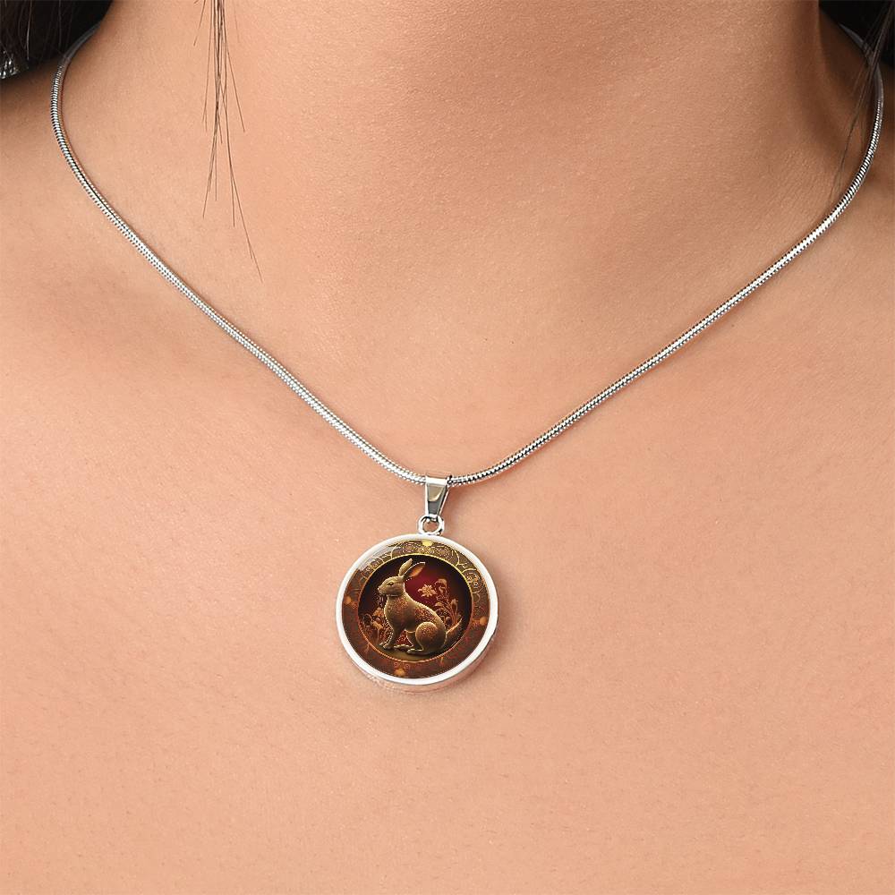 Woman wearing an elegant silver pendant Bunny Rabbit Necklace. The Colors are Red, Yellow and Black. This jewelry offers personalization with an engraving option for a name.