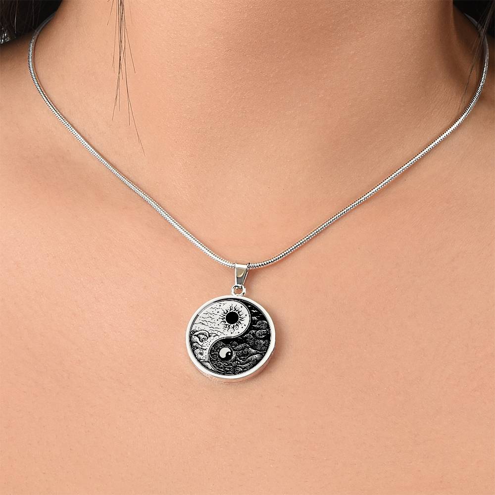 Woman wearing An Elegant silver pendant featuring a vivid Silver and Black Sun and Moon Necklace. This jewelry offers personalization with an engraving option for a name.