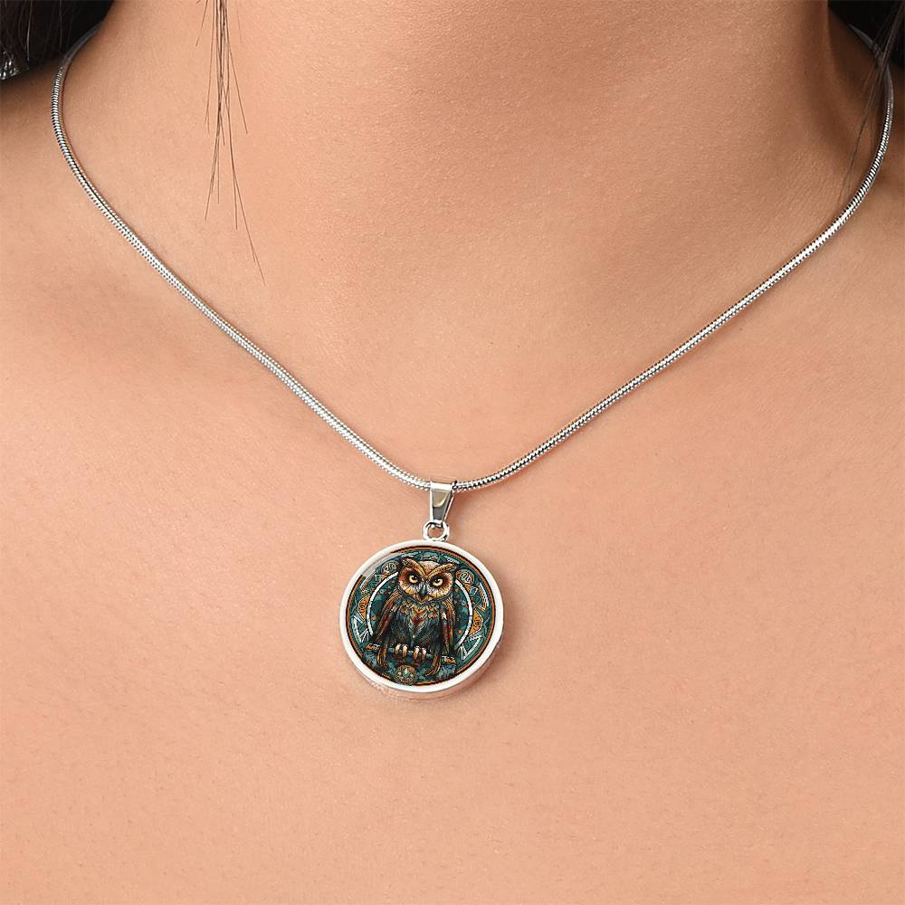 Woman wearing an elegant silver pendant featuring a Celtic Owl Necklace, set against a Green and orange backdrop. This jewelry offers personalization with an engraving option for a name.