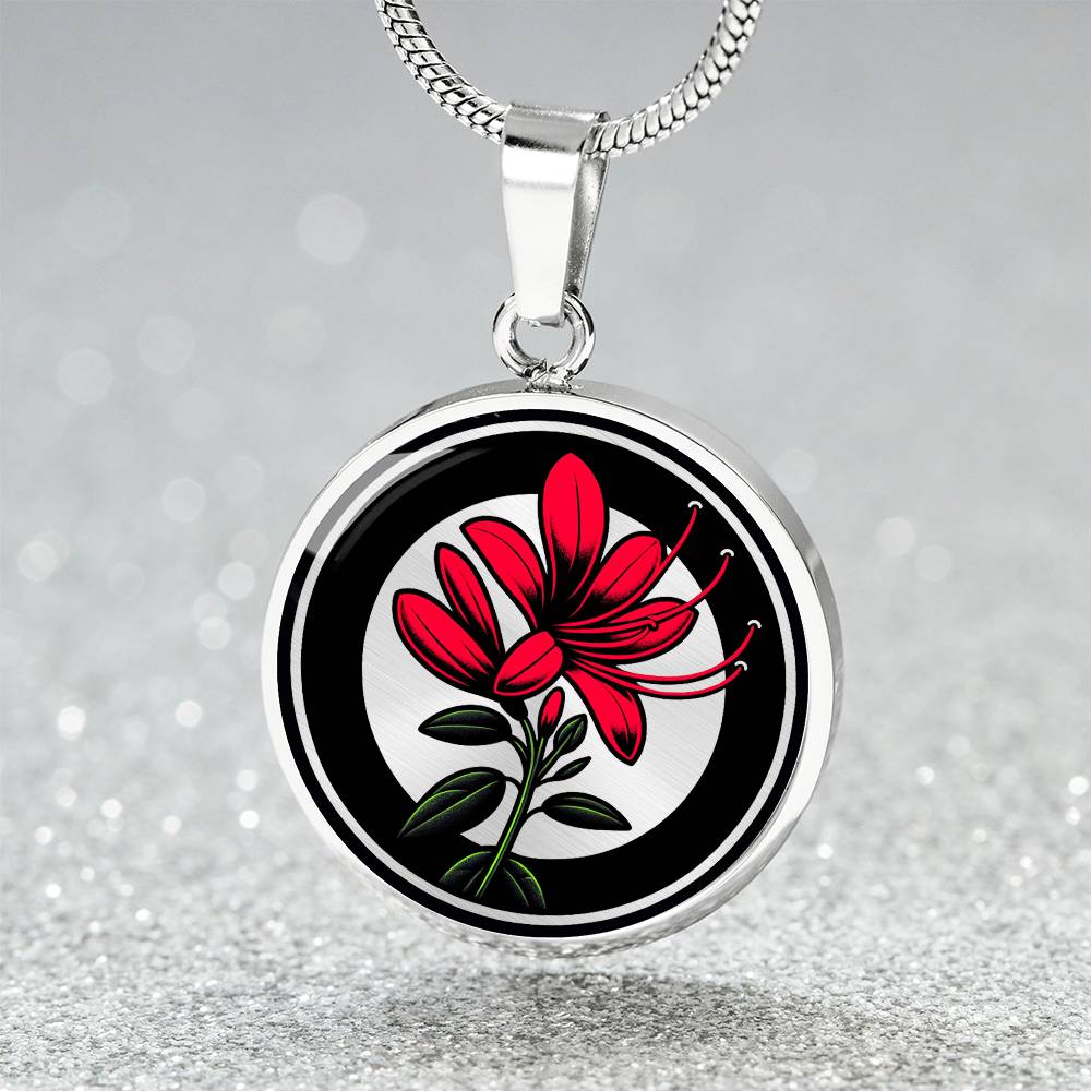 Elegant silver pendant featuring a vivid red honeysuckle, Junes birth month flower, set against a subtle tan backdrop. This necklace offers personalization with an engraving option for a name.