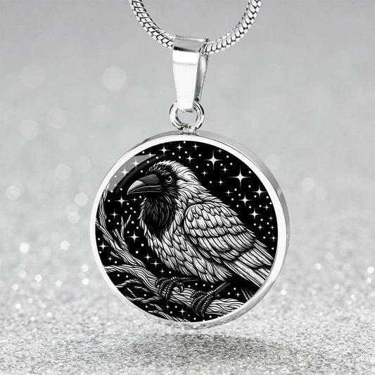 An elegant silver pendant Crow Necklace. The colors are gold and black. This jewelry offers personalization with an engraving option for a name.