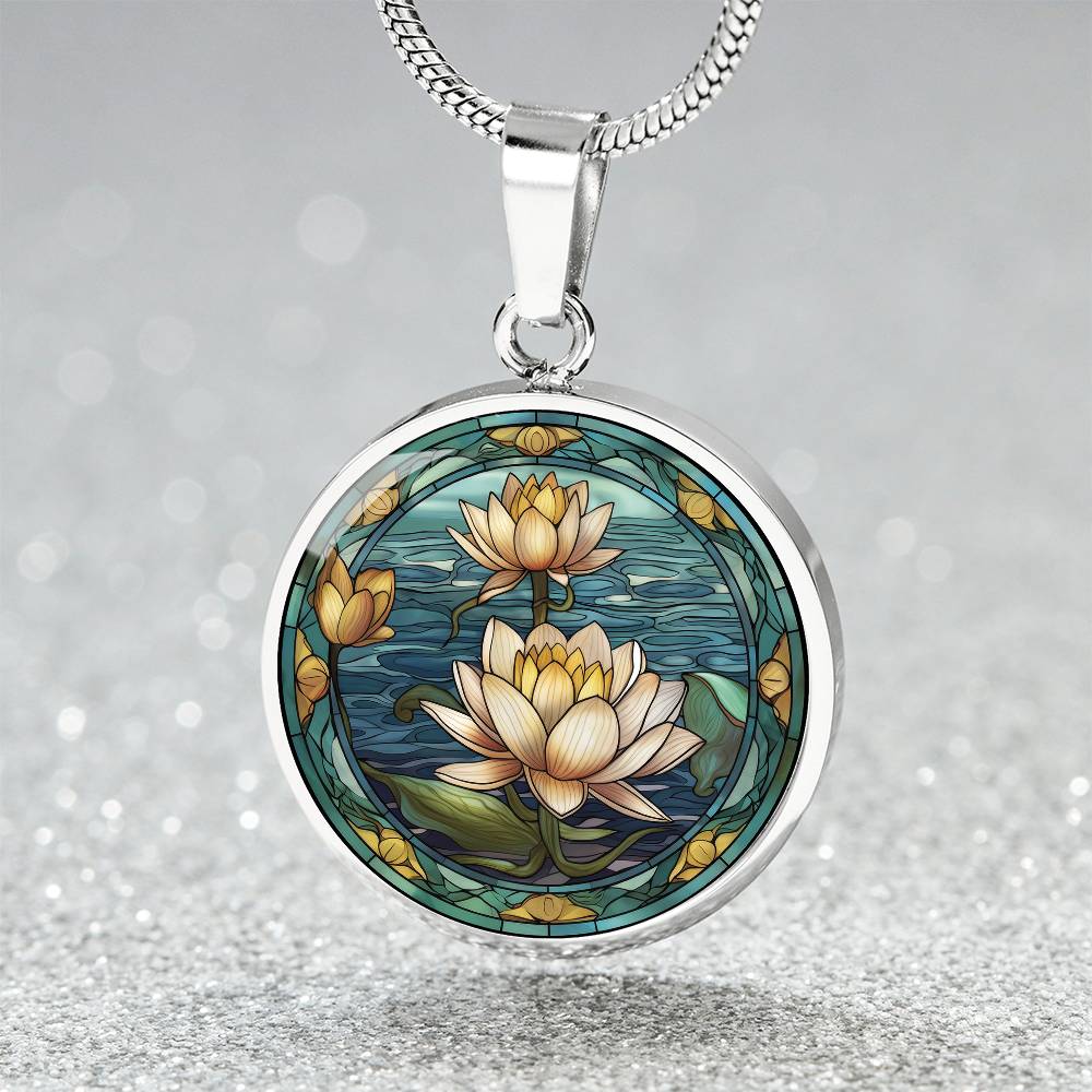 an elegant silver pendant Water Lily Necklace. The colors are Green Leaves, Blue Water and Tan Flowers. This jewelry offers personalization with an engraving option for a name.
