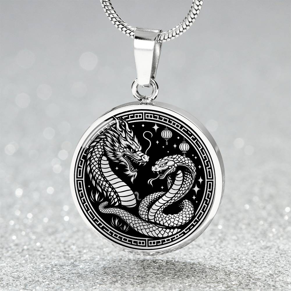An Elegant silver pendant featuring a Year of the Snake and Year of The Dragon Necklace in silver and black. This jewelry offers personalization with an engraving option for a name.