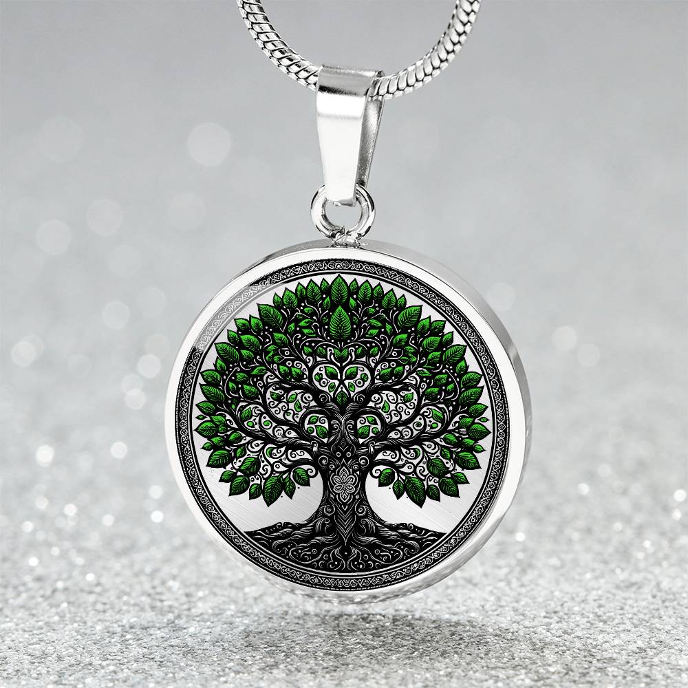 an Elegant silver pendant Celtic Tree of Life Necklace. Colors are black, silver and Green Leaves. This jewelry offers personalization with an engraving option for a name.