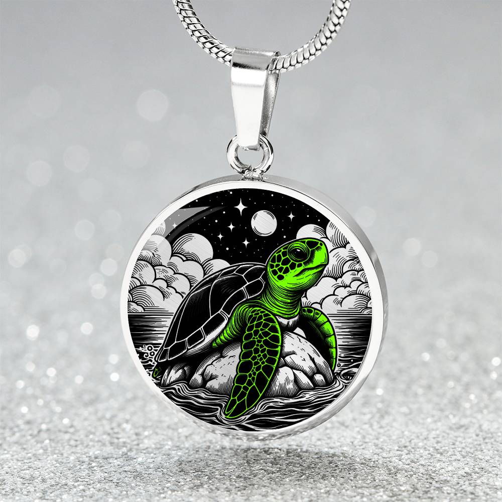 Elegant silver pendant featuring a vivid Green Turtle Necklace with a moon, Stars, Clouds and Ocean set against a black backdrop. This jewelry offers personalization with an engraving option for a name.