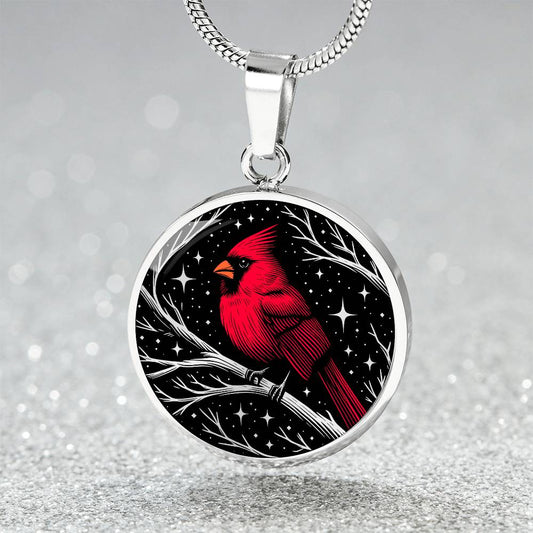 An Elegant silver pendant featuring a vivid Red Northern Cardinal Necklace with Stars and a tree Branch all in a silver and black backdrop. This jewelry offers personalization with an engraving option for a name.