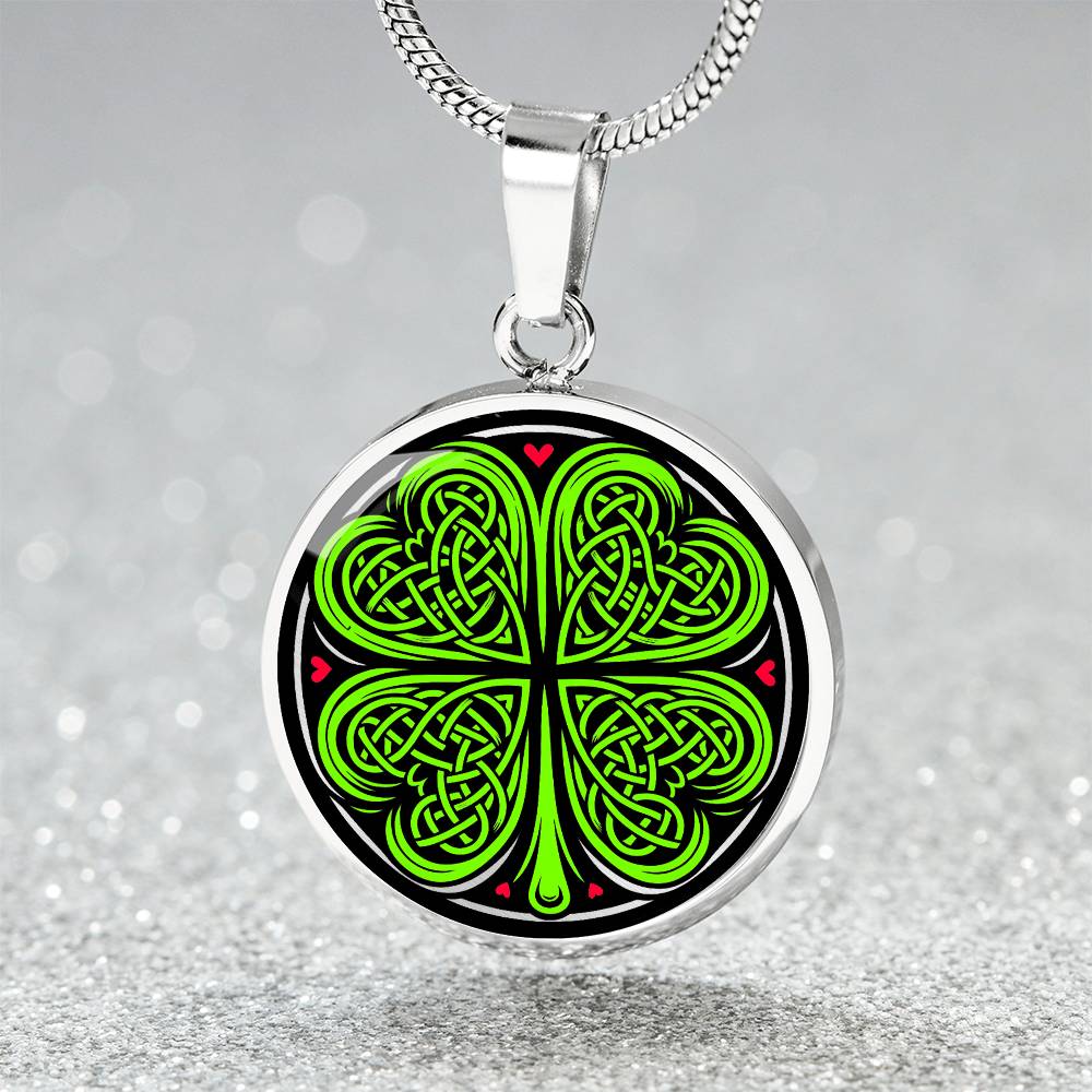 Elegant Silver pendant necklace featuring a vivid Celtic four leaf clover with four red & Green hearts, set against a subtle Black & silver backdrop. This jewelry offers personalization with an engraving option for a name.