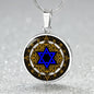 An Elegant silver pendant featuring a Vintage Design with a vivid blue Star of David Necklace, set against a gold, silver and black backdrop. This jewelry offers personalization with an engraving option for a name.