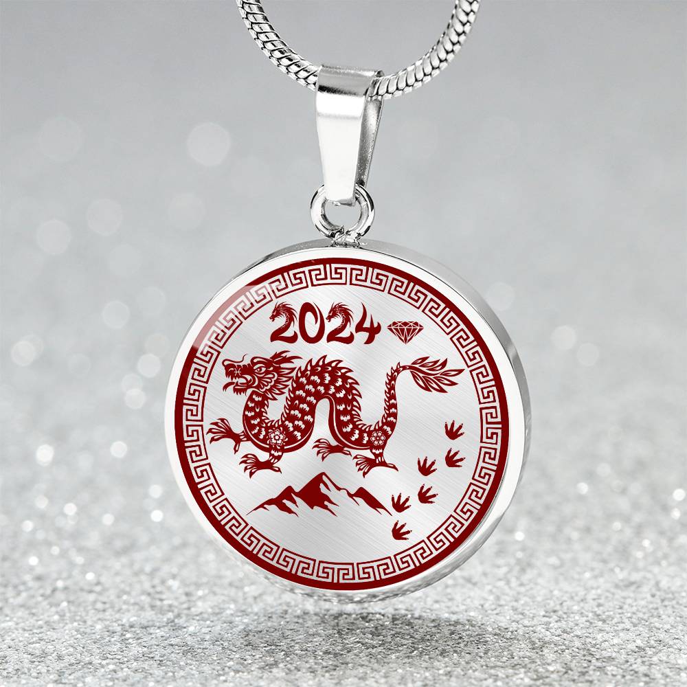 Elegant silver pendant necklace featuring a vivid red Dragon, set against a silver backdrop. This jewelry offers personalization with an engraving option for a name.