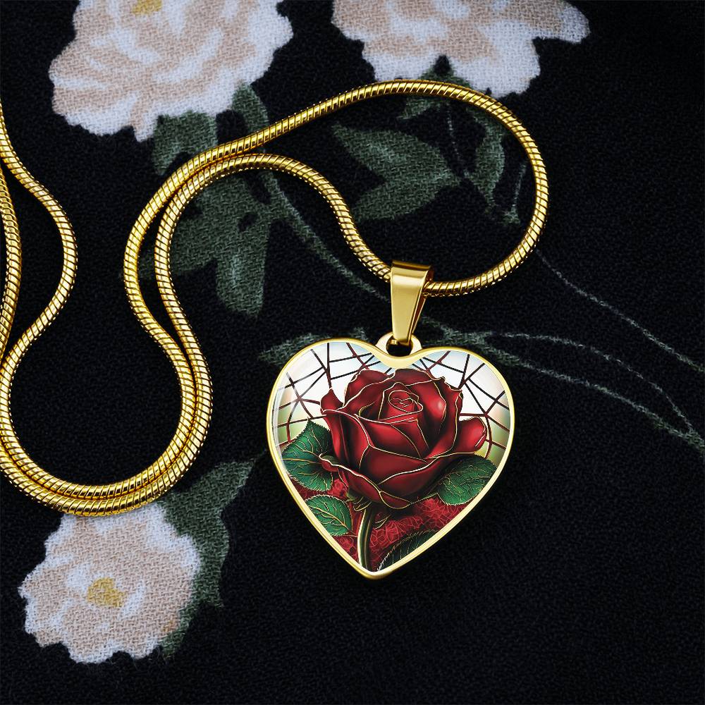 Elegant gold pendant featuring a vivid red Rose, June's birth month flower, set against a subtle stained glass backdrop. This necklace offers personalization with an engraving option for a name.