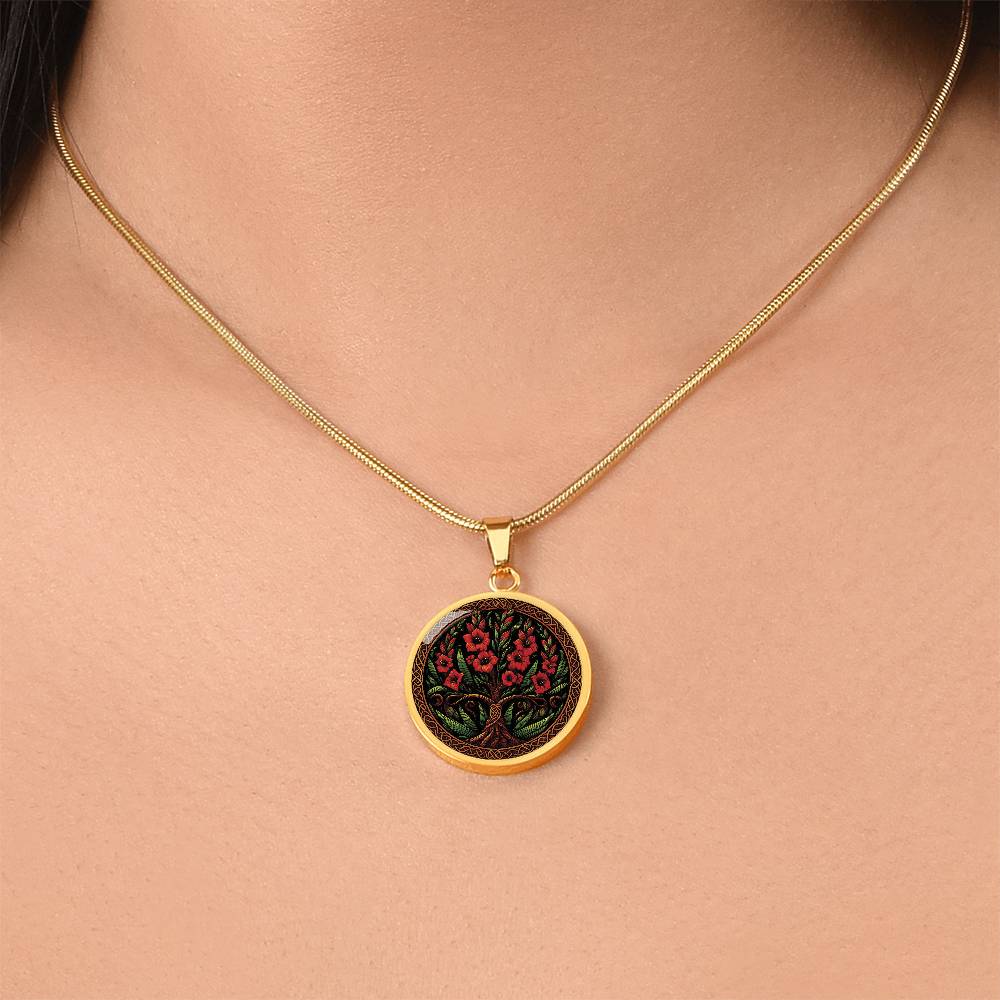 Woman wearing an elegant gold pendant Gladiolus Tree of Life Necklace. The Colors are red, green, brown and black. This jewelry offers personalization with an engraving option for a name.