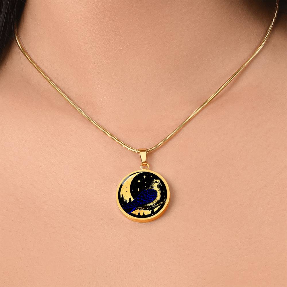 Woman wearing An Elegant gold pendant featuring a Blue Turtle Dove Necklace set against a black & gold night sky backdrop. This jewelry offers personalization with an engraving option for a name.
