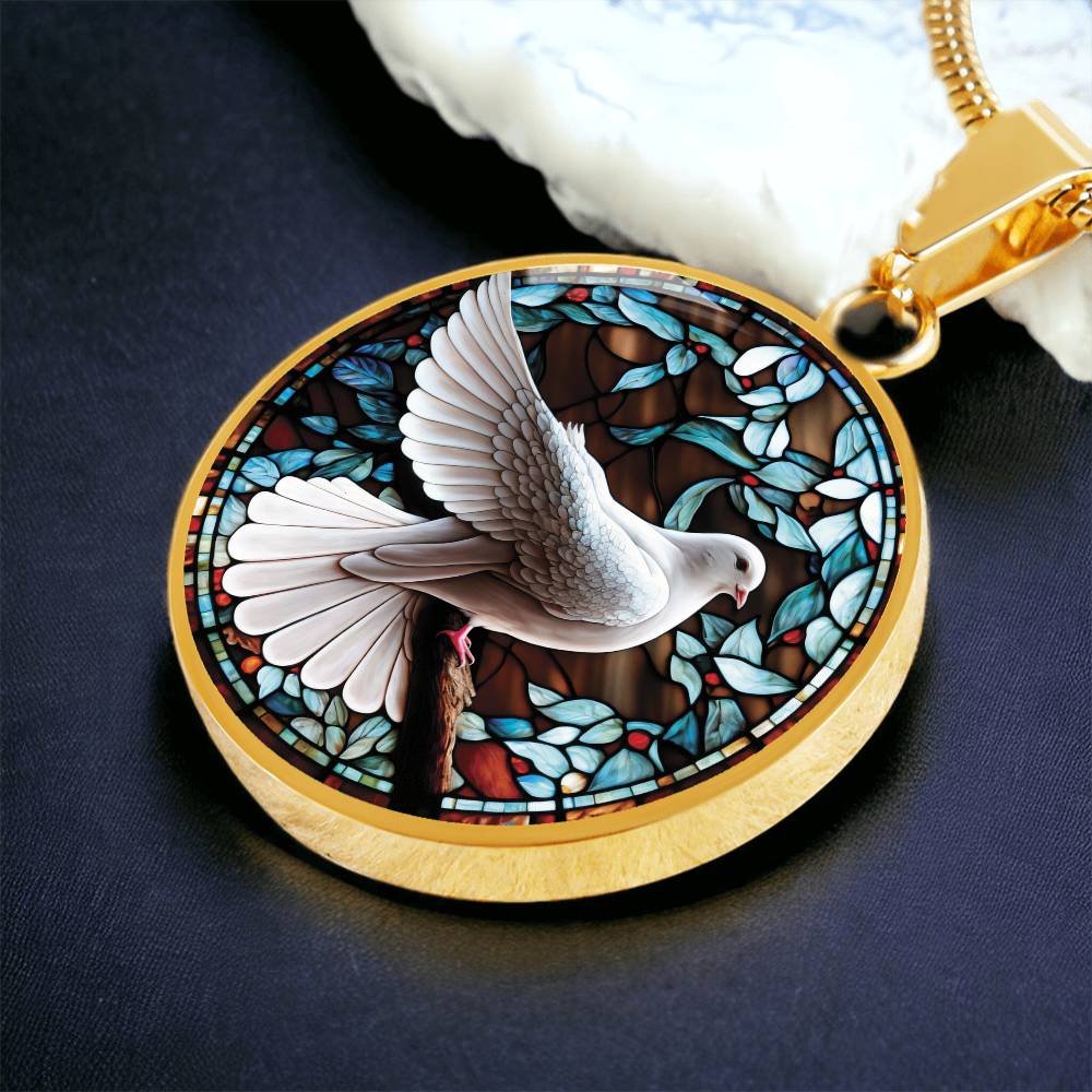 an Elegant gold pendant Dove Bird Necklace. featuring a white dove, green, blue, red colored border, leaves, berries with a brown background. This jewelry offers personalization with an engraving option for a name.