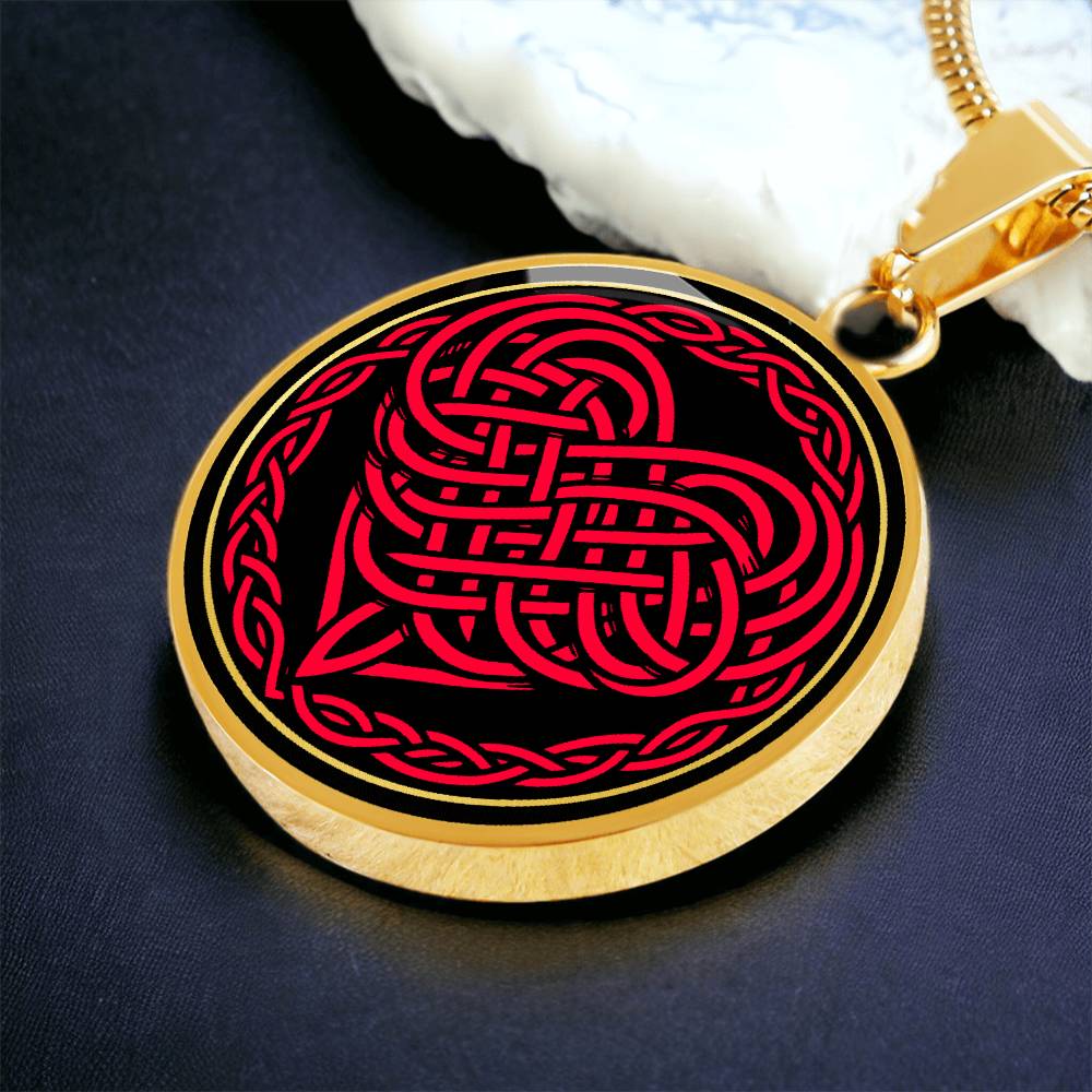 Elegant gold pendant featuring a vivid red Heart Celtic Necklace set against a Black & Gold backdrop. This jewelry offers personalization with an engraving option for a name.